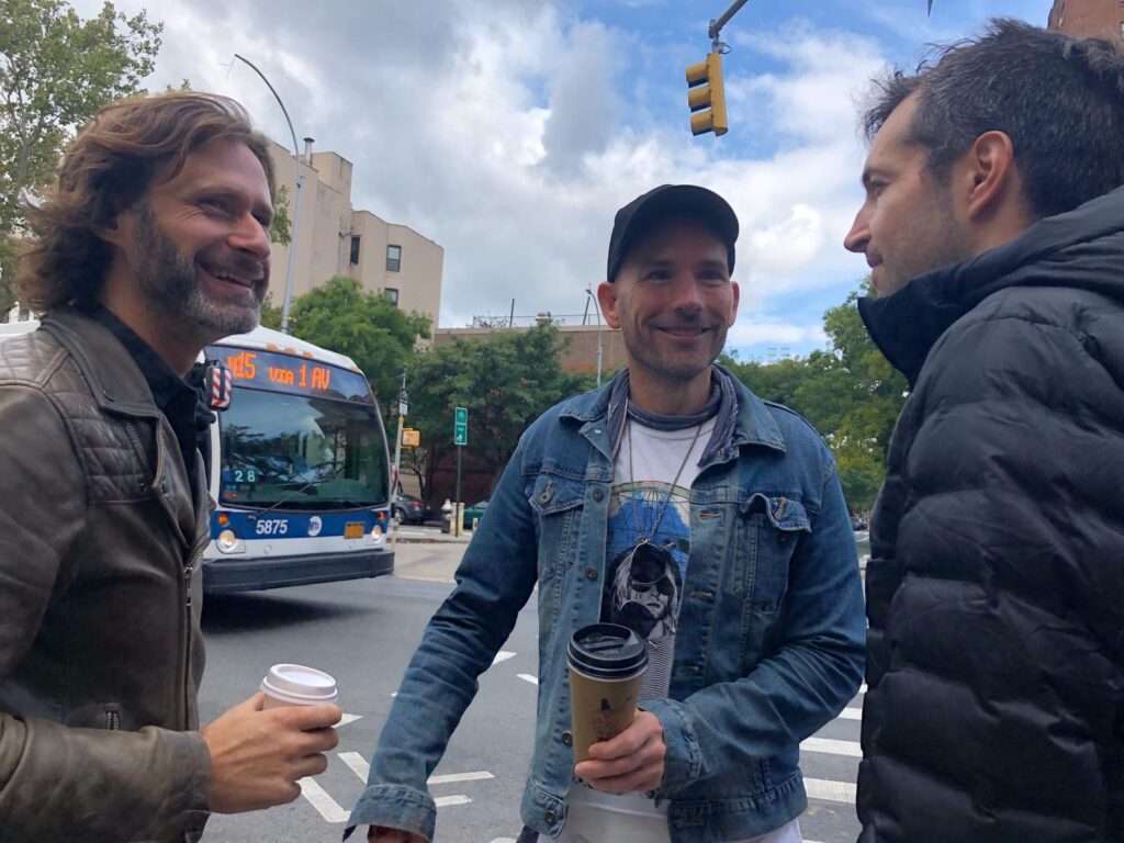 Dating coach John Keegan talking with clients on the street in NYC.
