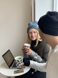 Man and woman having a casual conversation at a coffee shop in NYC